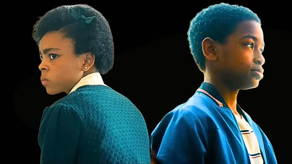 Will (right) and Ronie (left) in profile, back-to-back girl in teal sweater, boy in blue jacket.